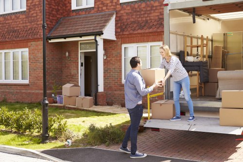 Furniture and boxes being arranged into a hired removal truck