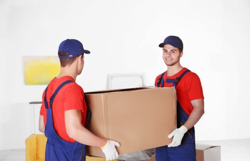 Moving van and packed boxes for a home move in Earlscourt