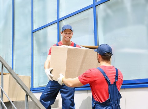 Careful packing of fragile items and furniture for a move in Earlscourt