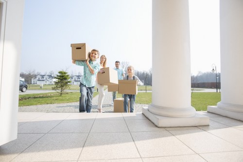 A moving team handling house removals in Earlscourt with careful loading