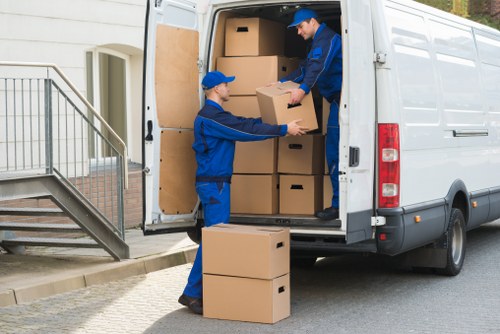 Packed boxes and furniture ready for transport in a local removal job