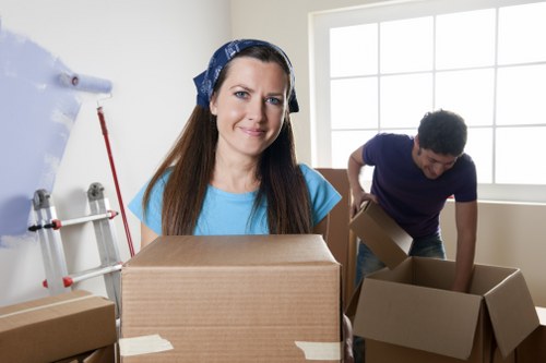 Careful furniture loading for Earlscourt removals in a busy city street