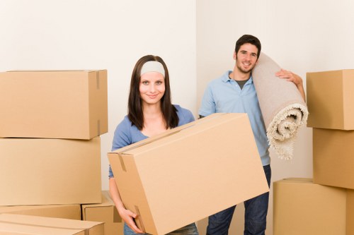 Local movers handling furniture in a residential street in Earlscourt